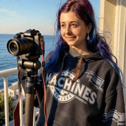 Emma-Jane MacKinnon-Lee recording outside with open sky